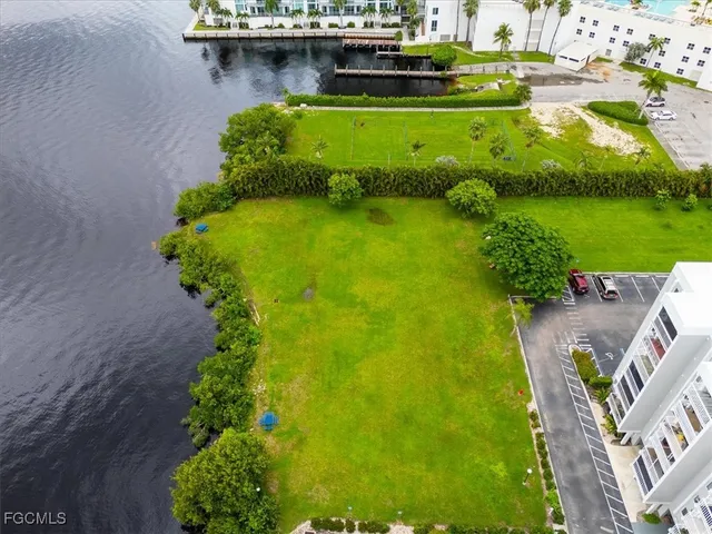 an aerial view of a house with yard swimming pool and outdoor seating