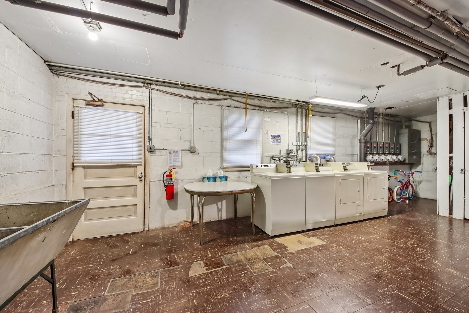 1855 Parkside Drive, Unit 8 Park Ridge, IL 60068 - Photo 19 of 22 a kitchen with a refrigerator and white cabinets