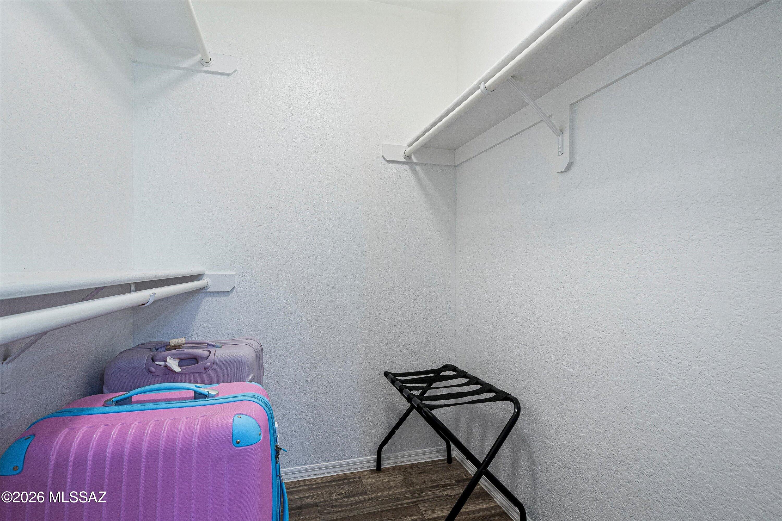 5800 North Kolb Road, Unit 1102 Tucson, AZ 85750 - Photo 14 of 36 a bedroom with a bed and wooden floor