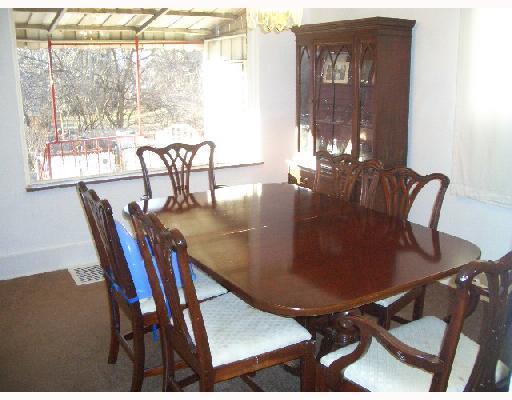 963 Stanford Road Brighton Heights, PA 15212 - Photo 4 of 8 Dining Room. Formal dining room highlighted by the contemporary chandelier and overlooking rear porch and yard.
