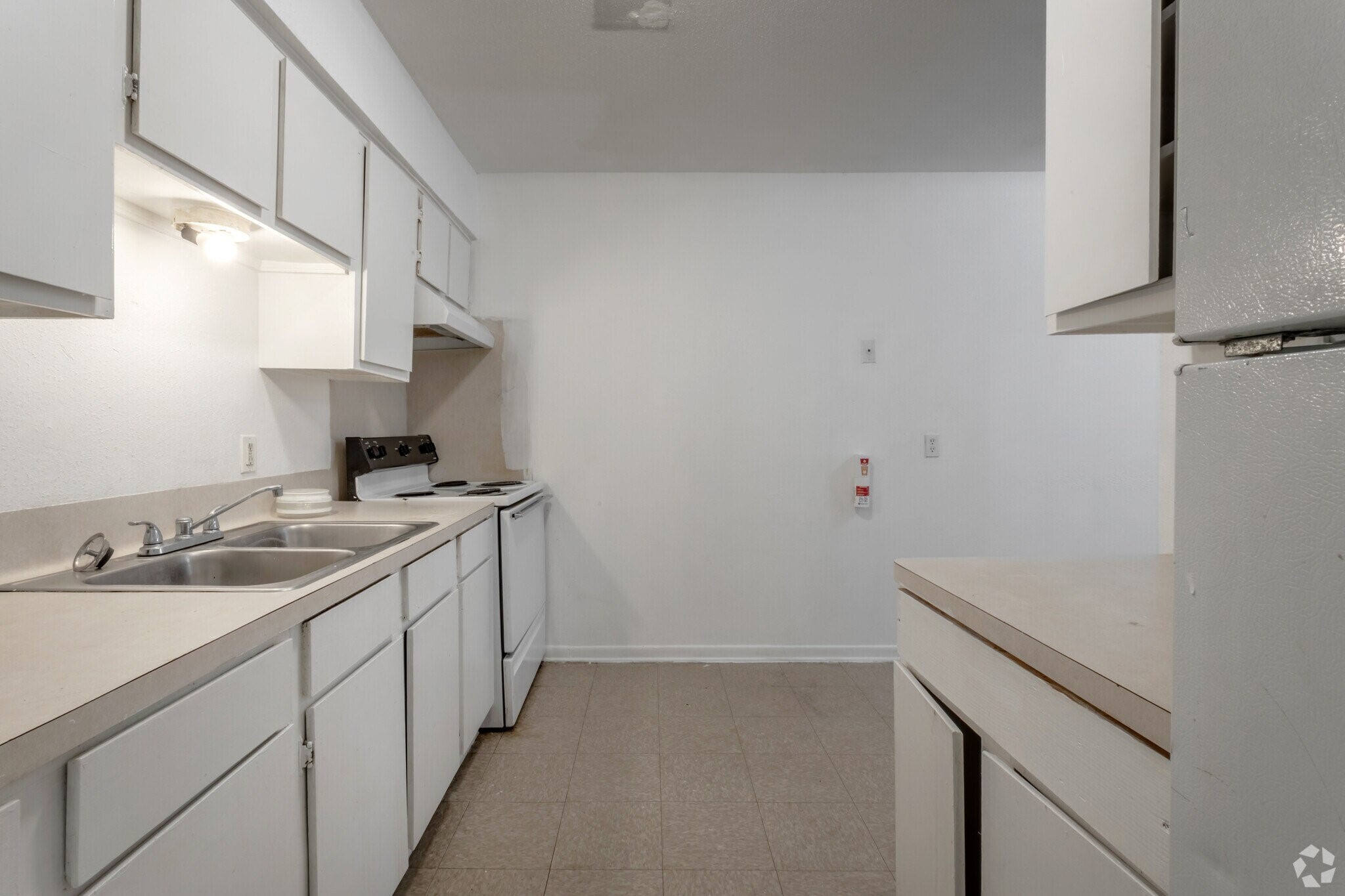 520 Laredo Street Navasota, TX 77868 - Photo 12 of 13 a kitchen with a sink and cabinets