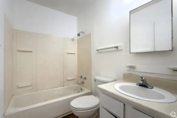 a bathroom with a sink toilet and bathtub