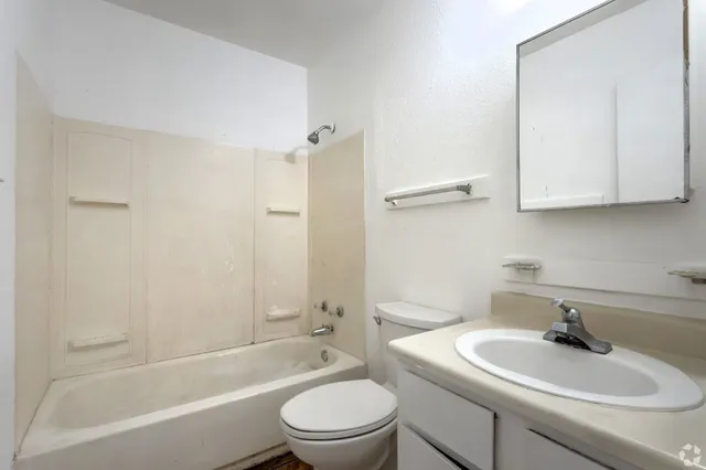 a bathroom with a sink toilet and bathtub