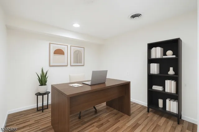 a living room with furniture a rug and a table