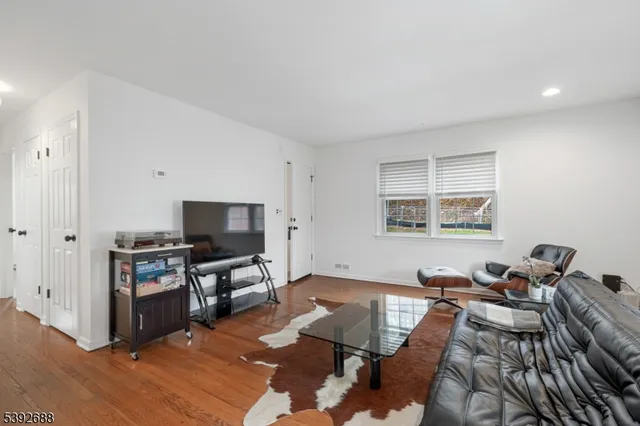 a kitchen with a refrigerator sink stove and white cabinets