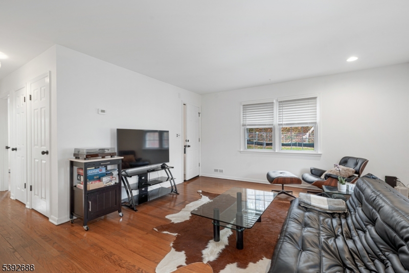 76 Mt Kemble Avenue, Unit 2 Morristown, NJ 07960 - Photo 8 of 23 a living room with furniture and a flat screen tv