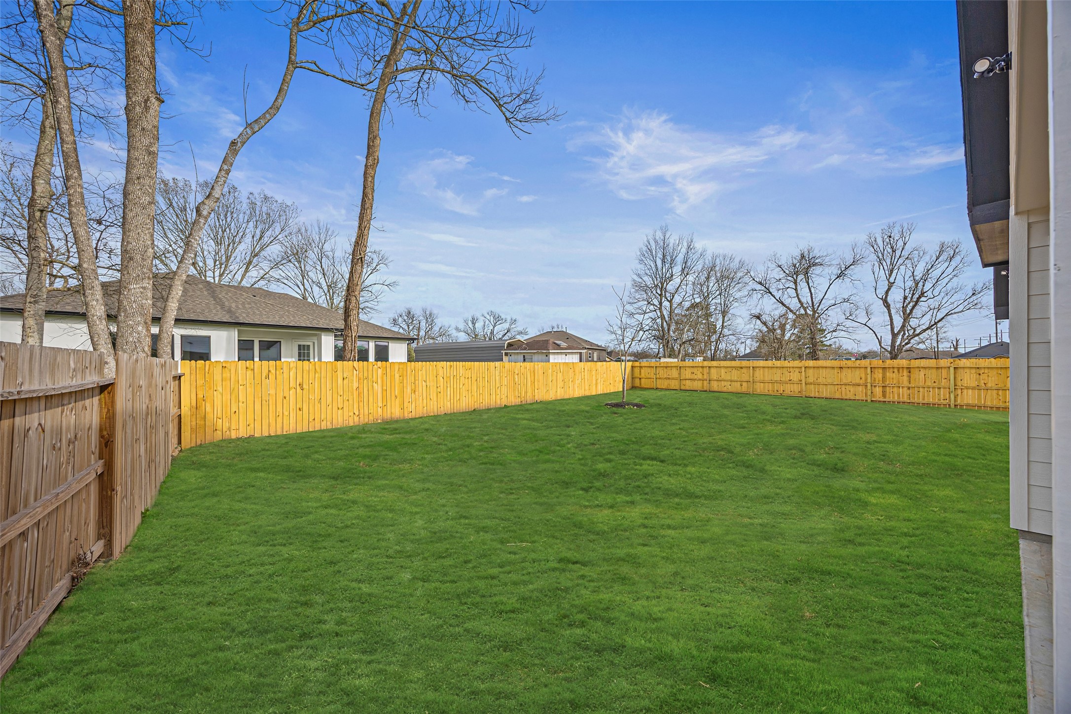 1807 Waco Street Dayton, TX 77535 - Photo 25 of 26 Generous fenced yard and plenty of room for a pool, playset, or garden.