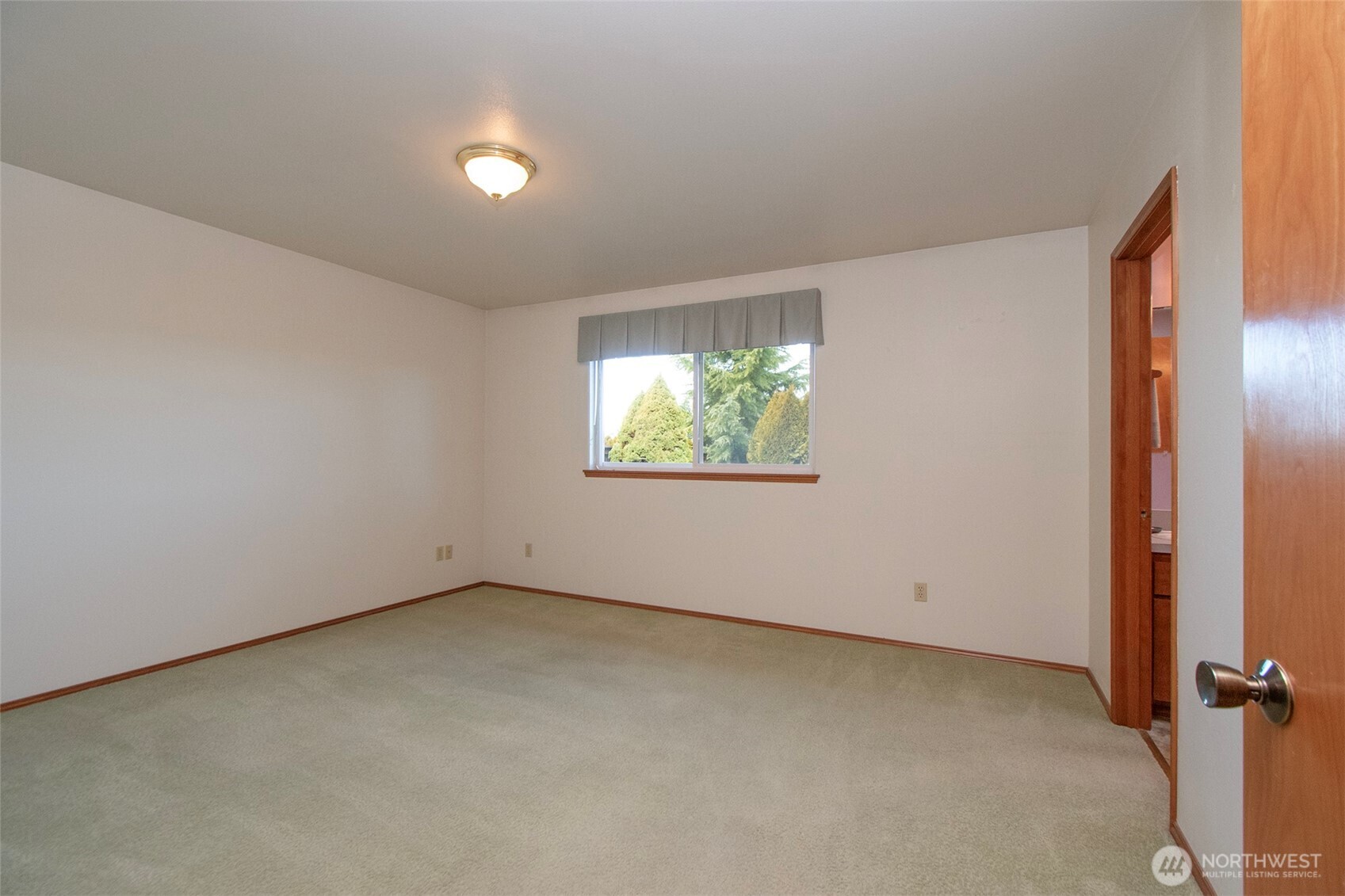 151 Duke Drive Sequim, WA 98382 - Photo 11 of 39 an empty room with windows and entrance