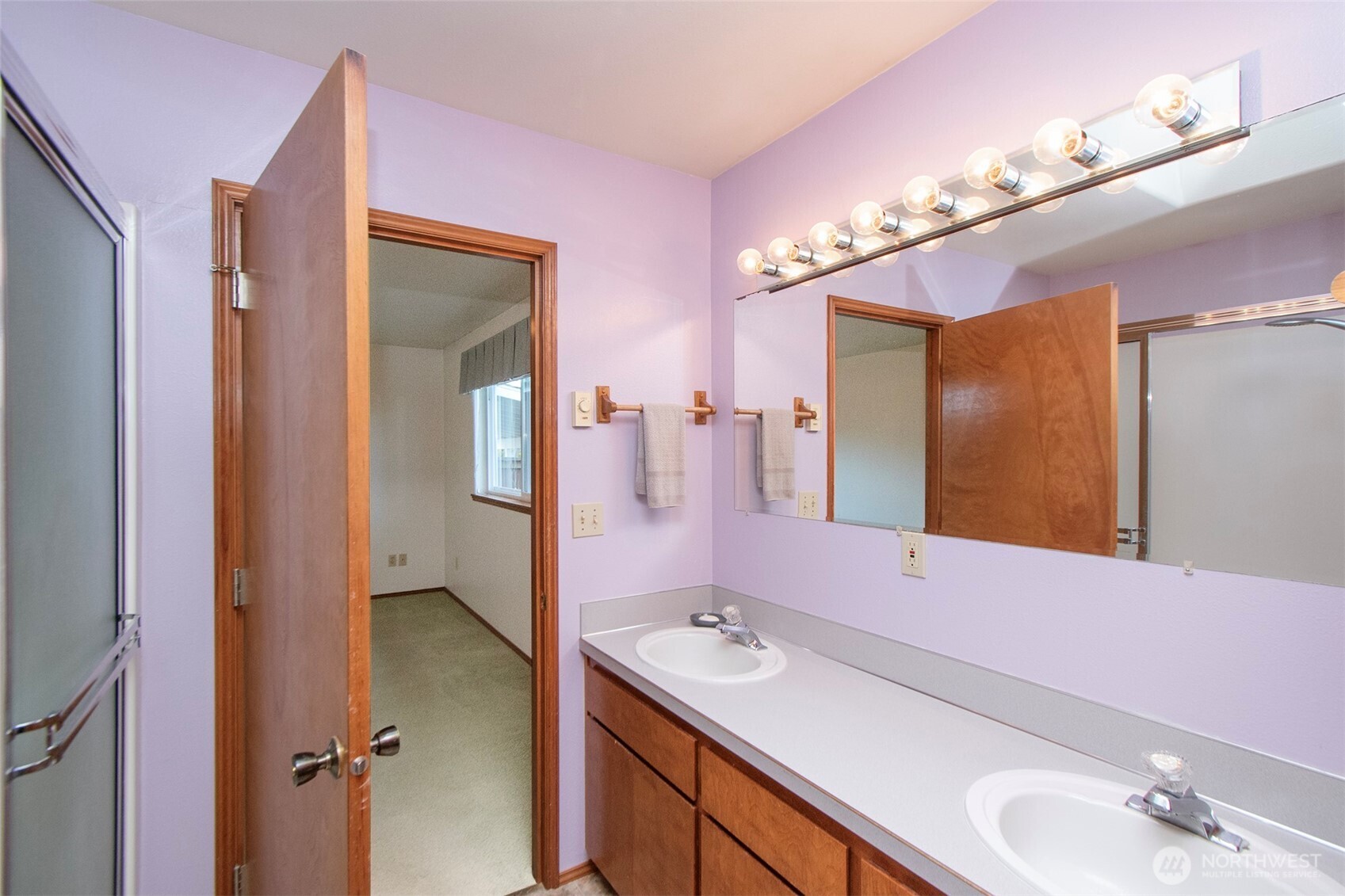 151 Duke Drive Sequim, WA 98382 - Photo 15 of 39 a bathroom with a double vanity sink and mirror