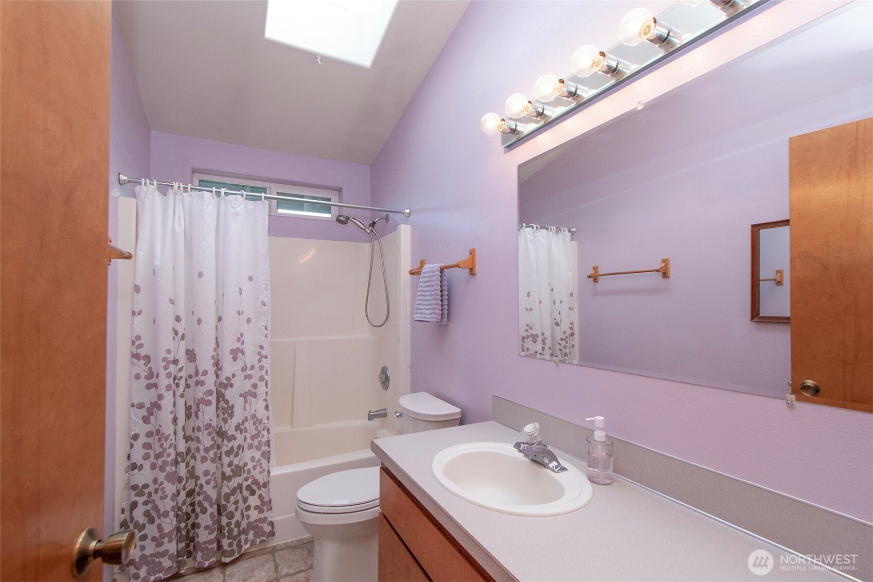 151 Duke Drive Sequim, WA 98382 - Photo 17 of 39 a bathroom with a sink a toilet a large mirror and shower