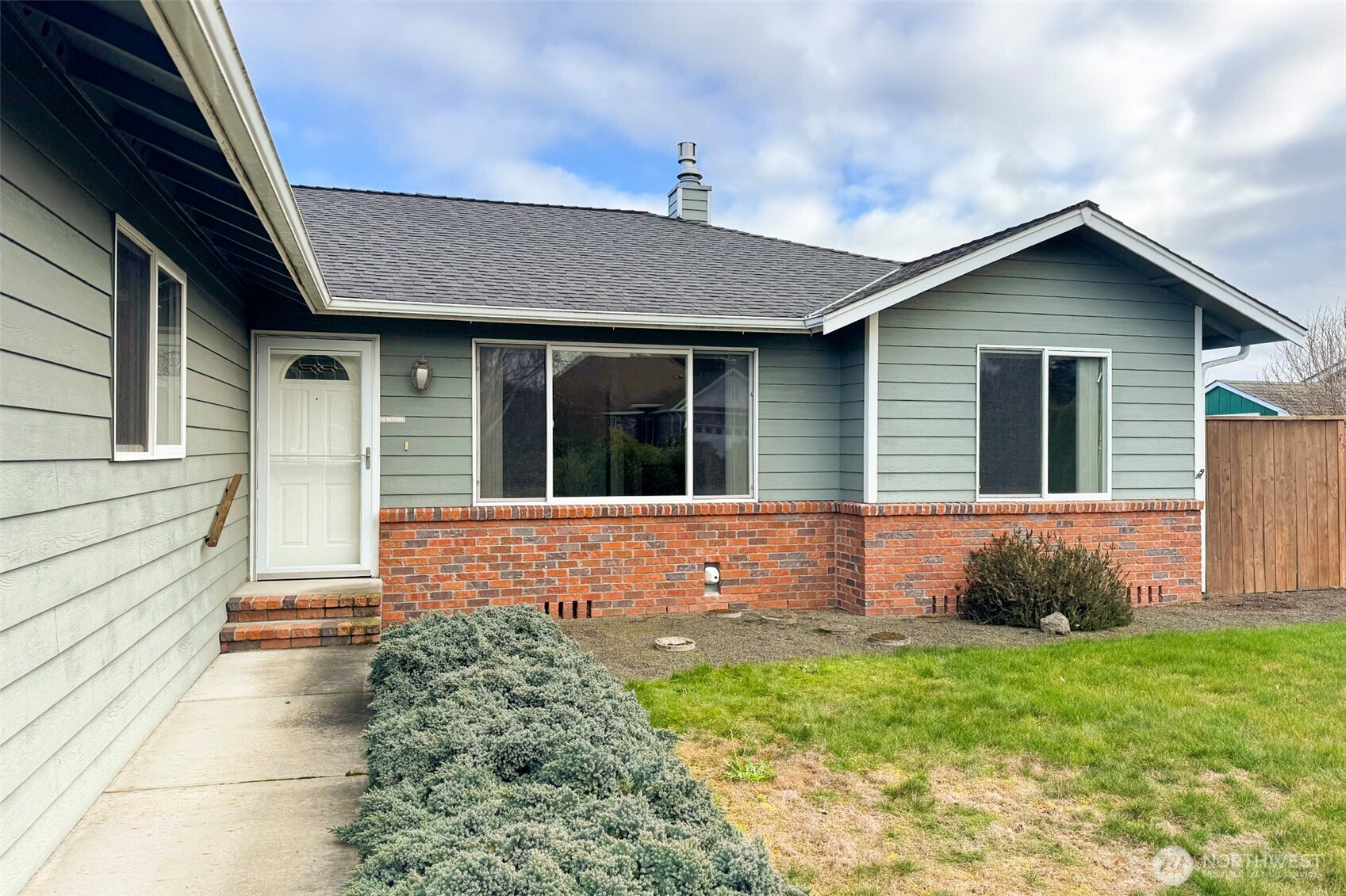 151 Duke Drive Sequim, WA 98382 - Photo 3 of 39 a front view of a house with garden