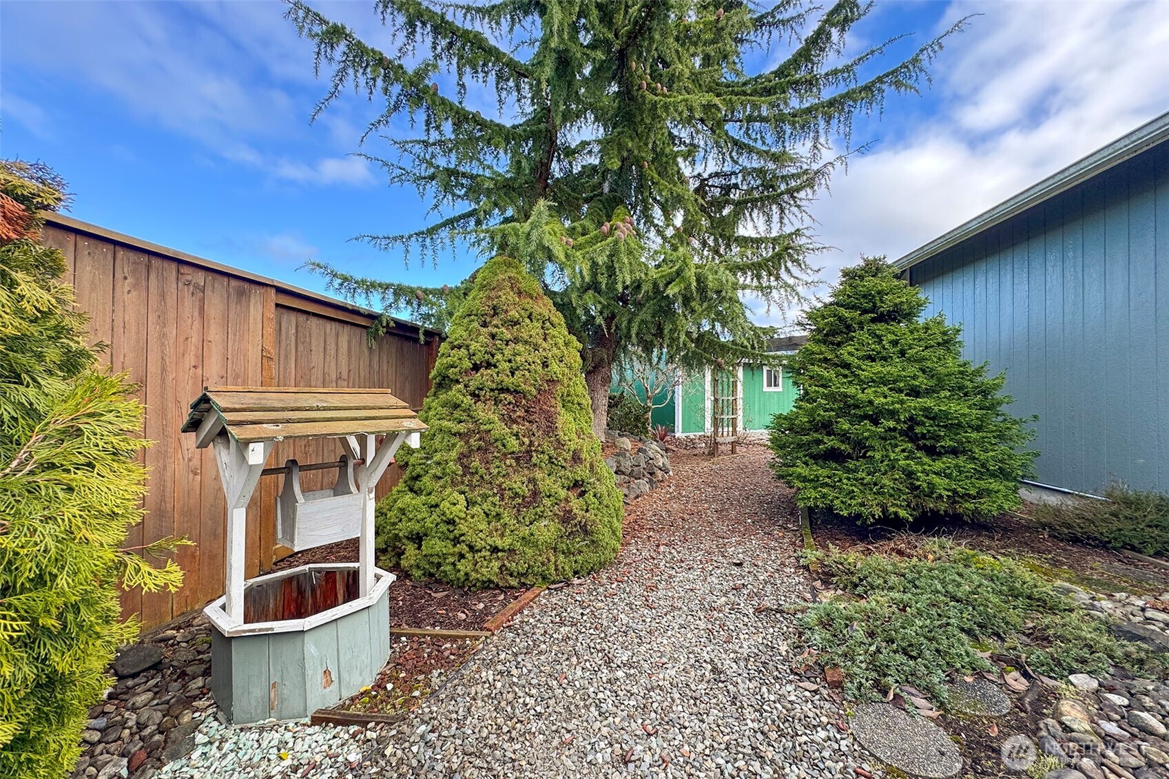 151 Duke Drive Sequim, WA 98382 - Photo 35 of 39 a backyard of a house with lots of green space