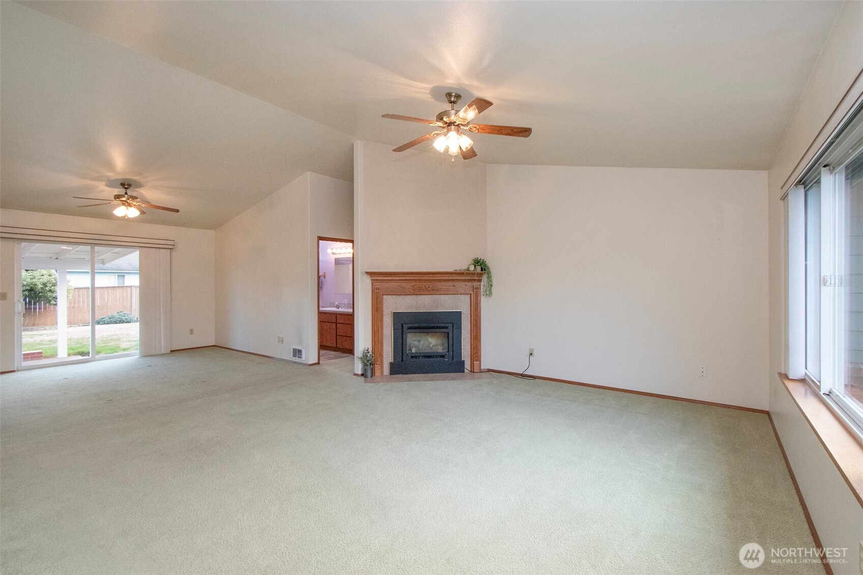 151 Duke Drive Sequim, WA 98382 - Photo 4 of 39 a view of empty room with fireplace and fan