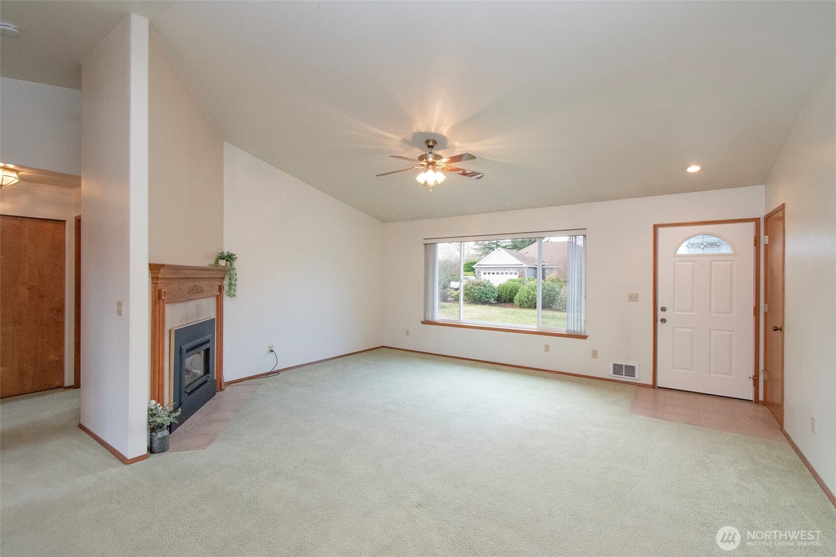 151 Duke Drive Sequim, WA 98382 - Photo 5 of 39 an empty room with windows and ceiling fan