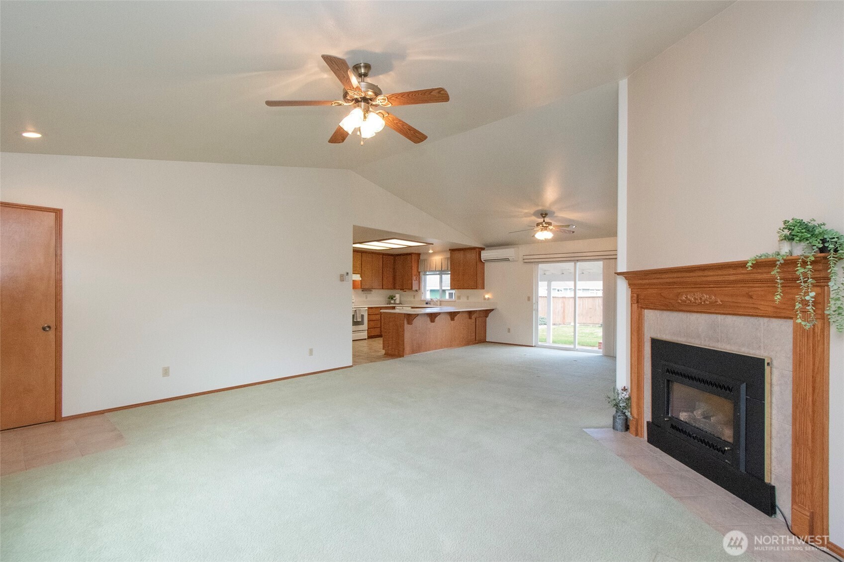 151 Duke Drive Sequim, WA 98382 - Photo 6 of 39 a view of a livingroom with a fireplace and fan