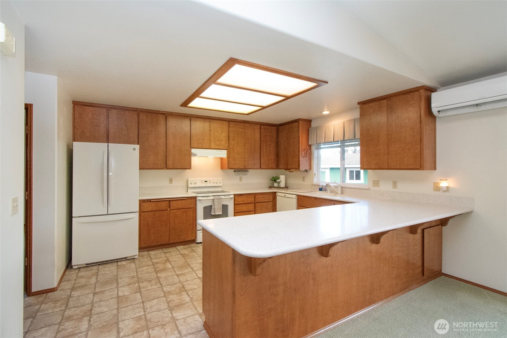 151 Duke Drive Sequim, WA 98382 - Photo 8 of 39 a kitchen with a sink a stove a refrigerator and a cabinets