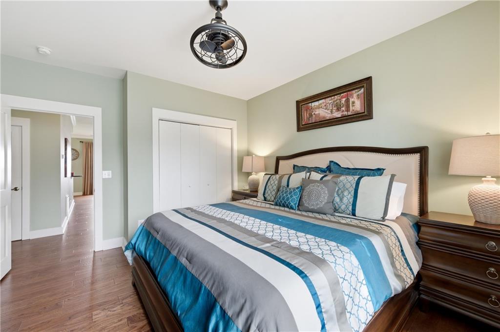 117 South Bay Road, Unit 402 Eatonton, GA 31024 - Photo 35 of 48 a bedroom with a bed and a lamp