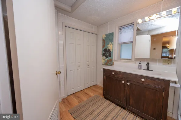 a white toilet sitting next to a bathroom sink