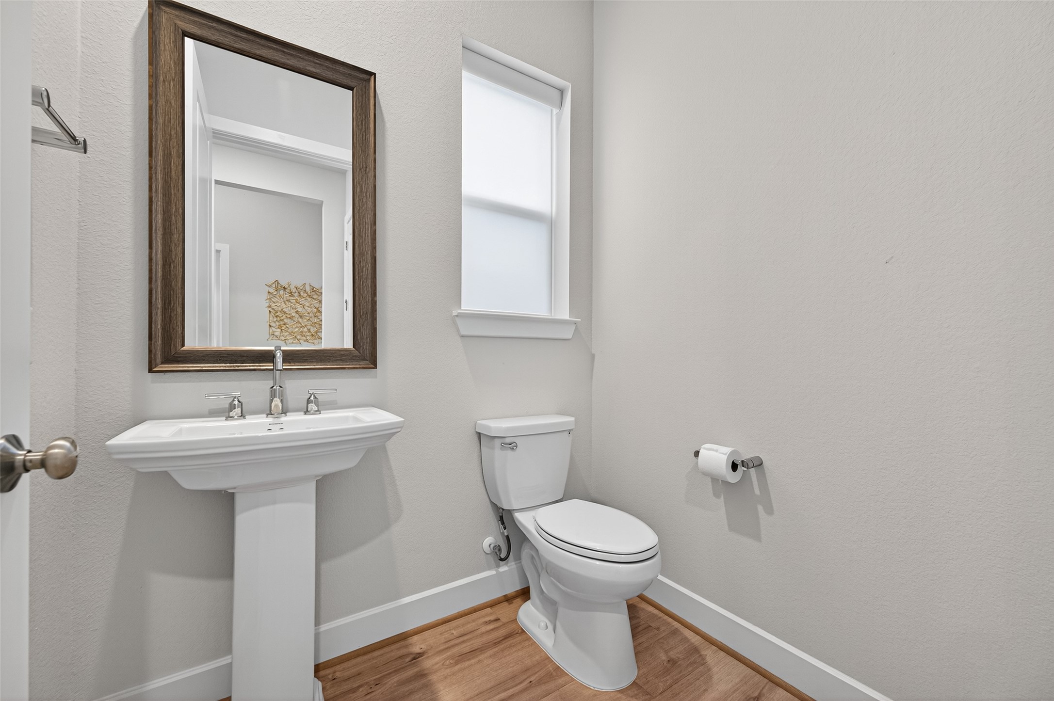 4714 Copper Falls Lane Fulshear, TX 77441 - Photo 13 of 44 a bathroom with a toilet sink and mirror