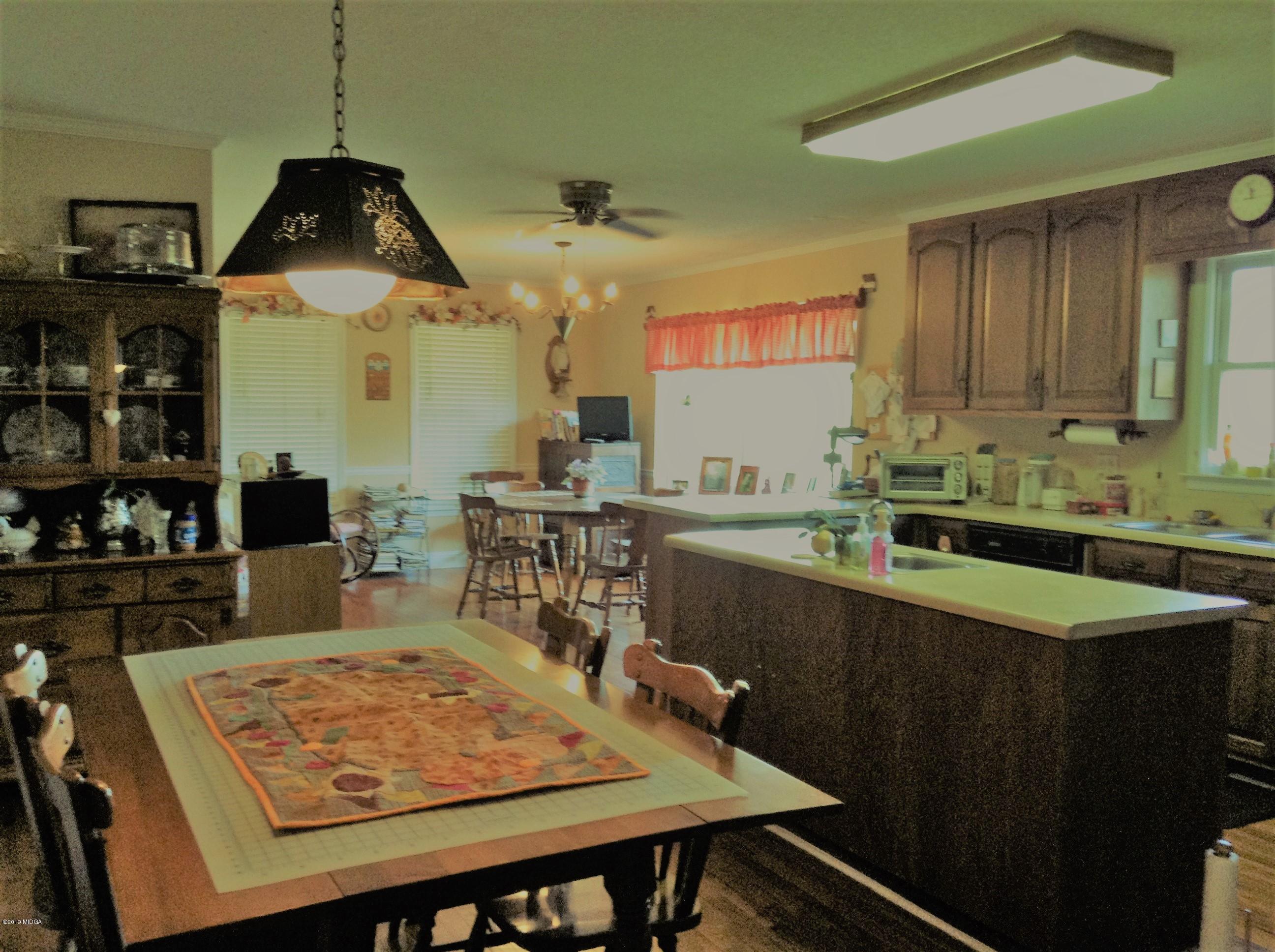 1661 Bonner Gilbert Road Macon, GA 31220 - Photo 12 of 15 a kitchen with a table and chairs in it