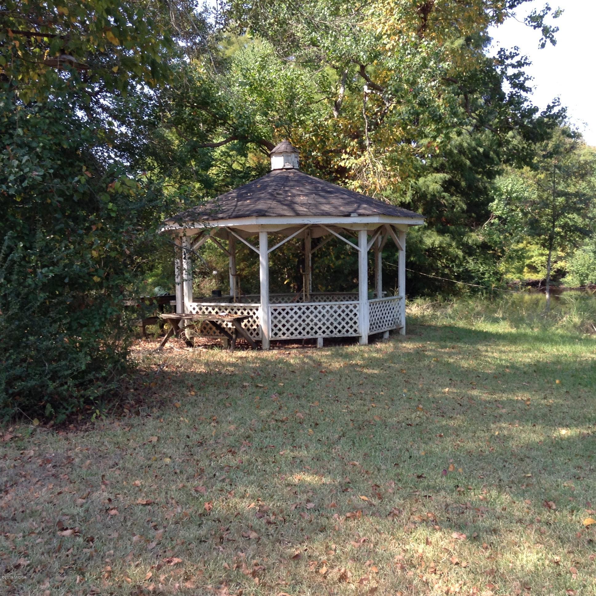 1661 Bonner Gilbert Road Macon, GA 31220 - Photo 5 of 15 a view of a house with a yard