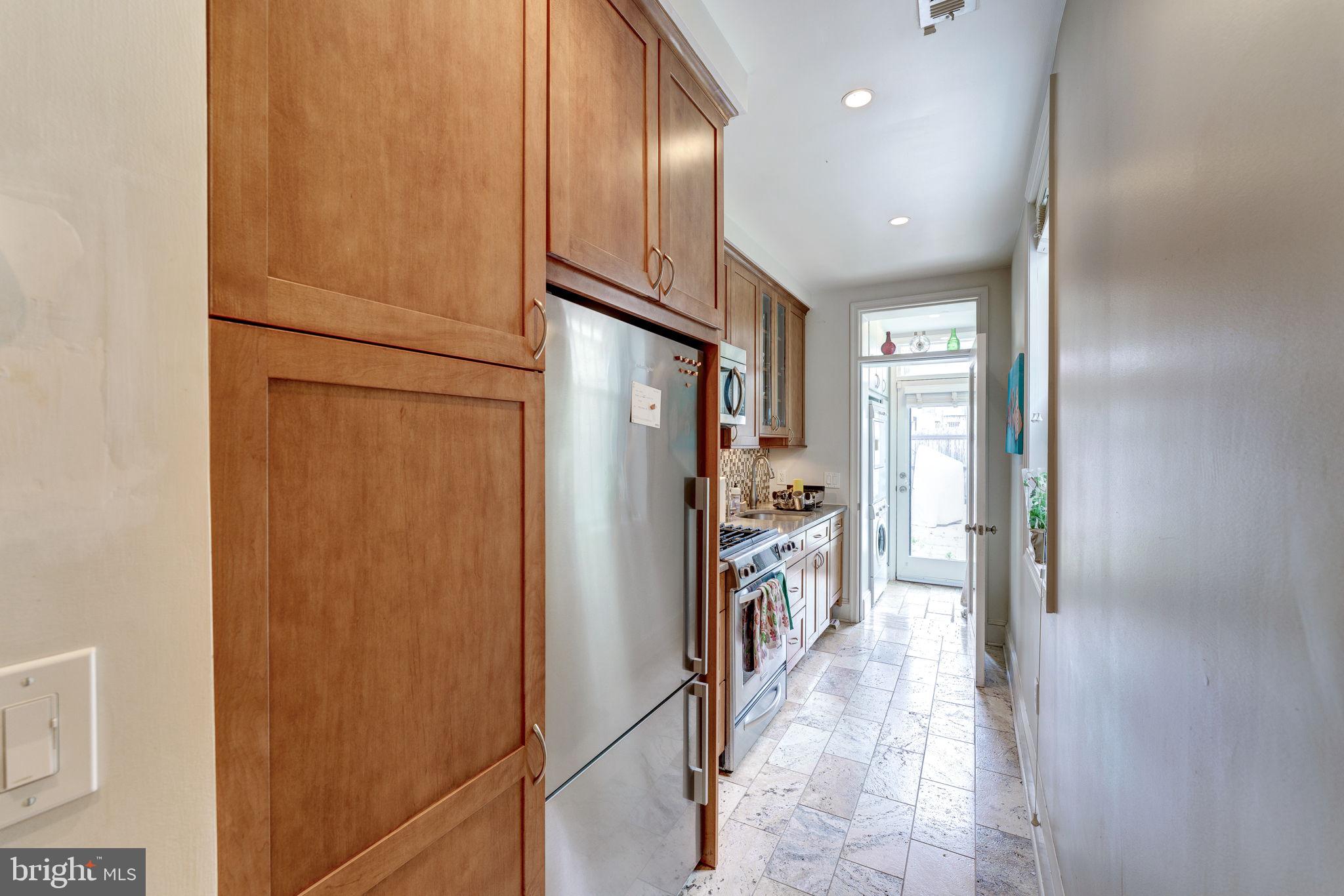 602 14th Place Northeast Washington, DC 20002 - Photo 11 of 34 Kitchen has SS appliances & cherry cabinetry!