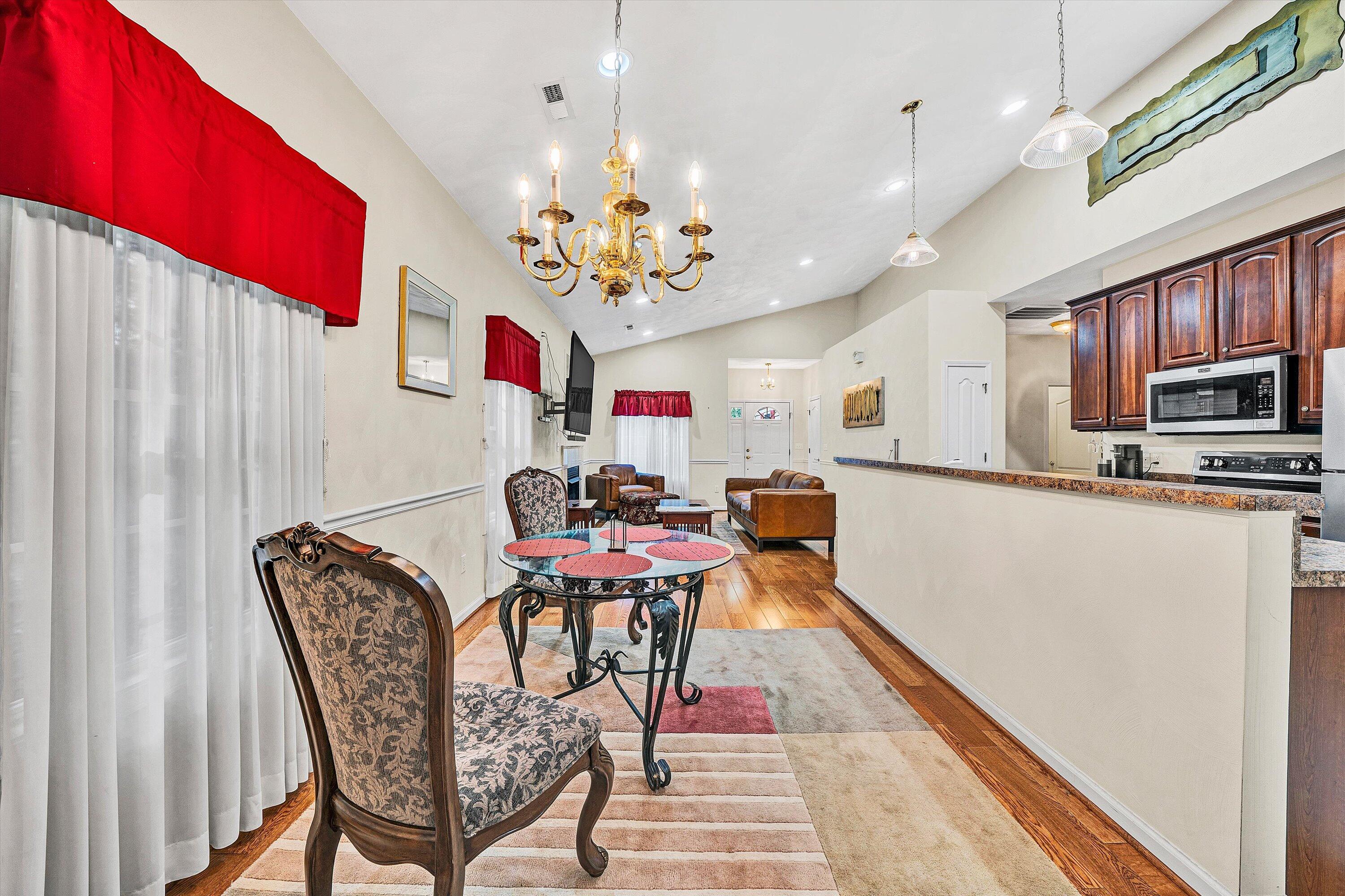80 Stoney Mill Road Rocky Mount, VA 24151 - Photo 12 of 27 a view of a dining room with furniture and chandelier