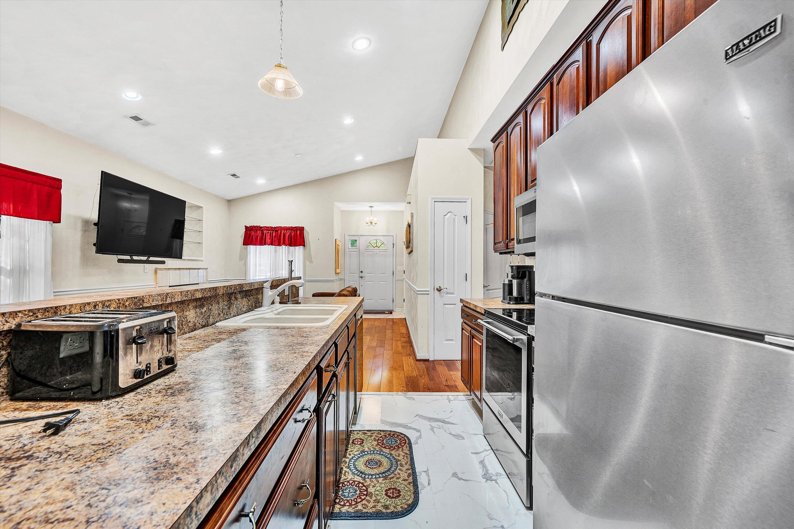 80 Stoney Mill Road Rocky Mount, VA 24151 - Photo 13 of 27 a kitchen with stainless steel appliances granite countertop a refrigerator a stove and a sink with cabinets