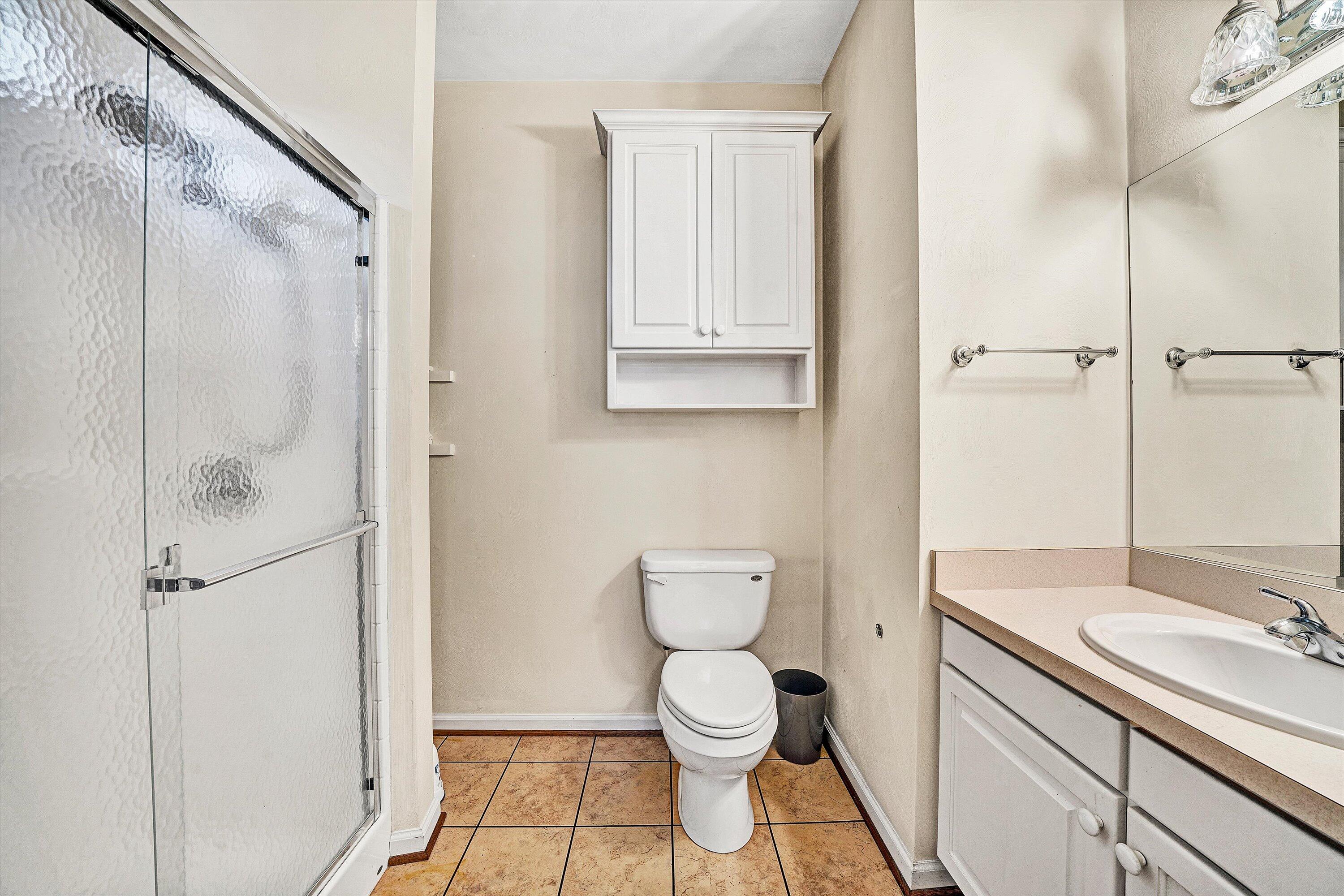 80 Stoney Mill Road Rocky Mount, VA 24151 - Photo 18 of 27 a bathroom with a granite countertop sink toilet and shower