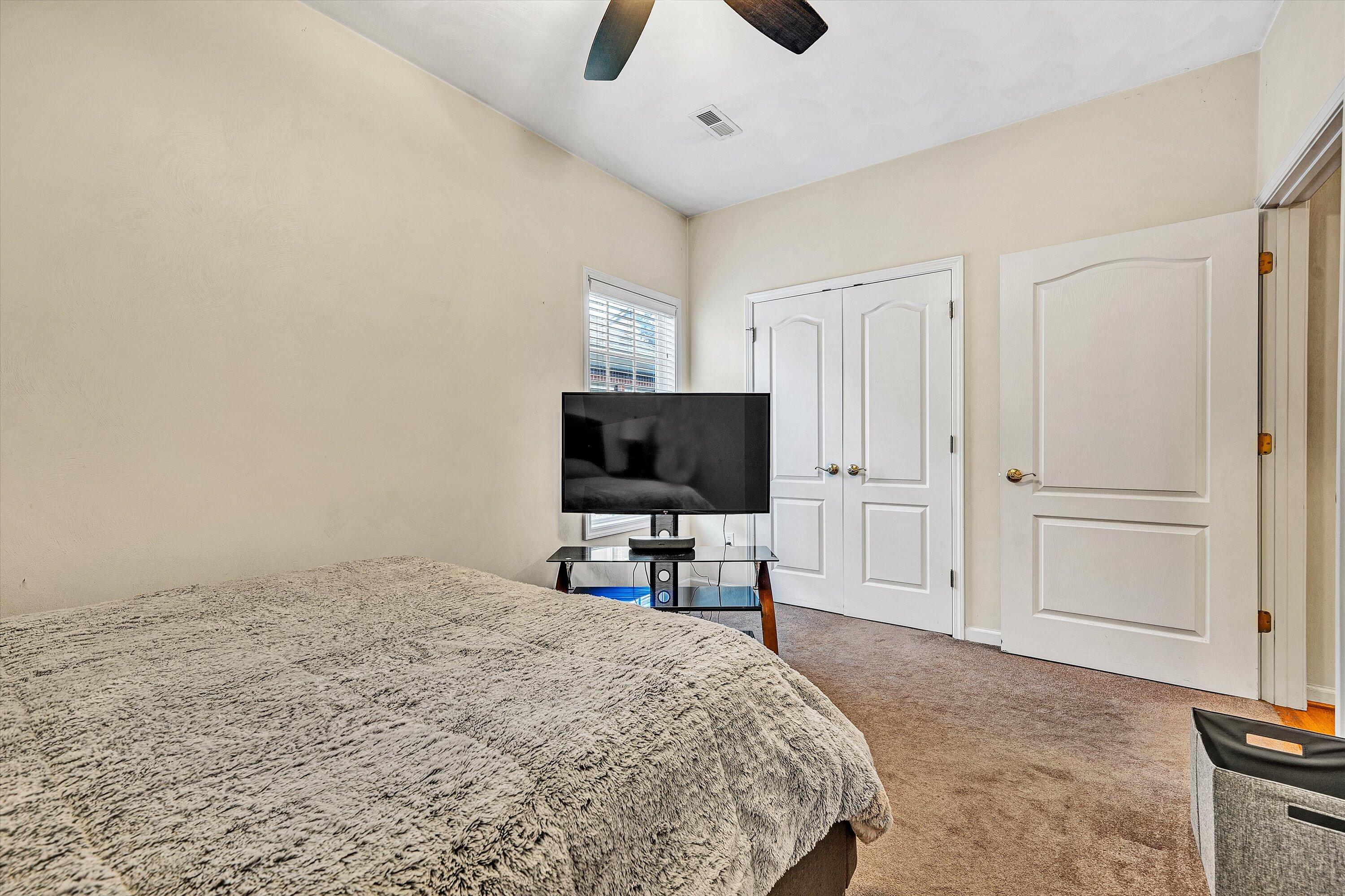 80 Stoney Mill Road Rocky Mount, VA 24151 - Photo 24 of 27 a bedroom with a bed and a flat screen tv