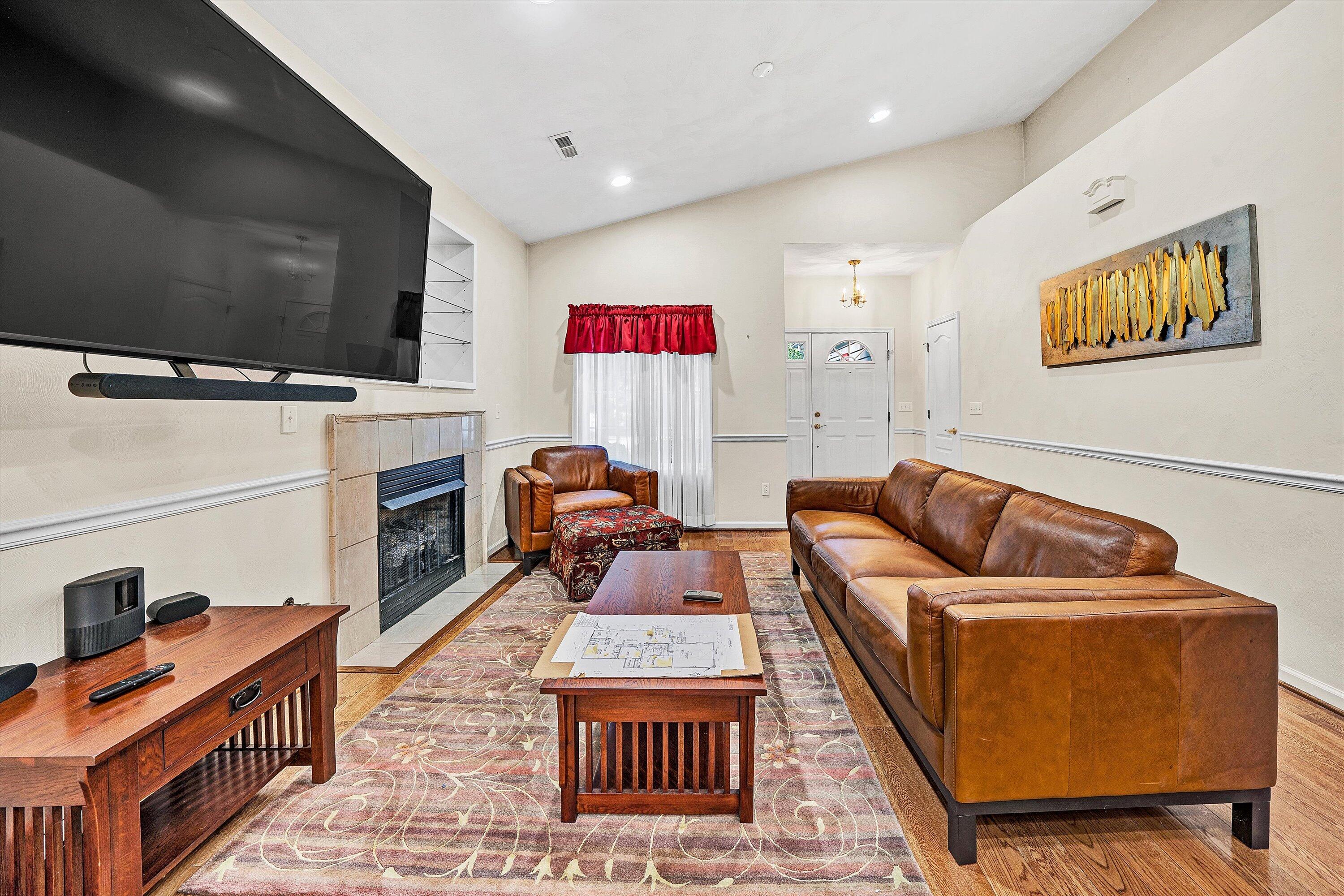 80 Stoney Mill Road Rocky Mount, VA 24151 - Photo 8 of 27 a living room with furniture a flat screen tv and a fireplace