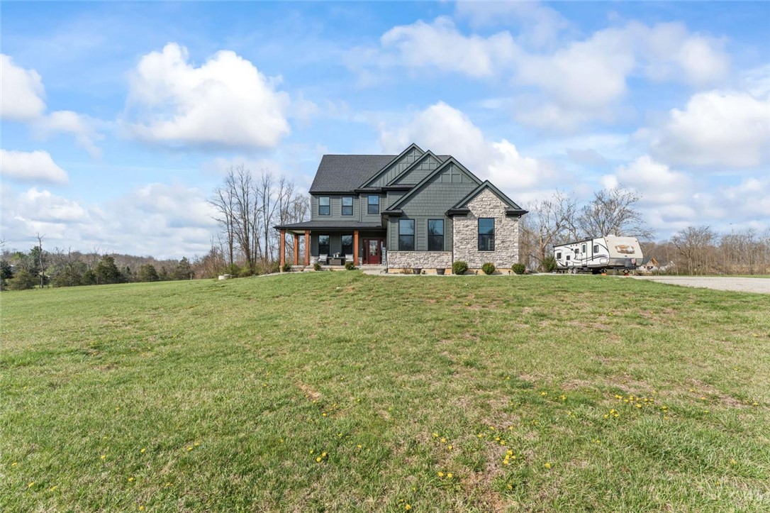 2425 Middleboro Road Clarksville, OH 45113 - Photo 3 of 91 This grand home with inviting porch offers ample space and modern design.