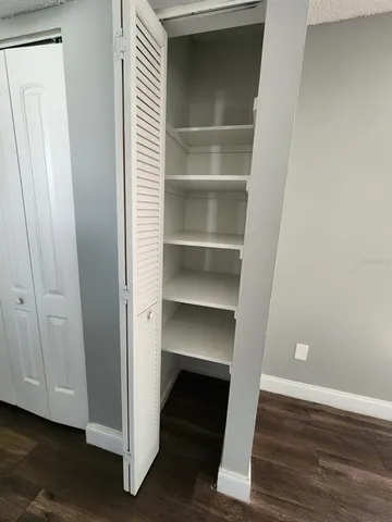 a bathroom with a toilet a sink and a window