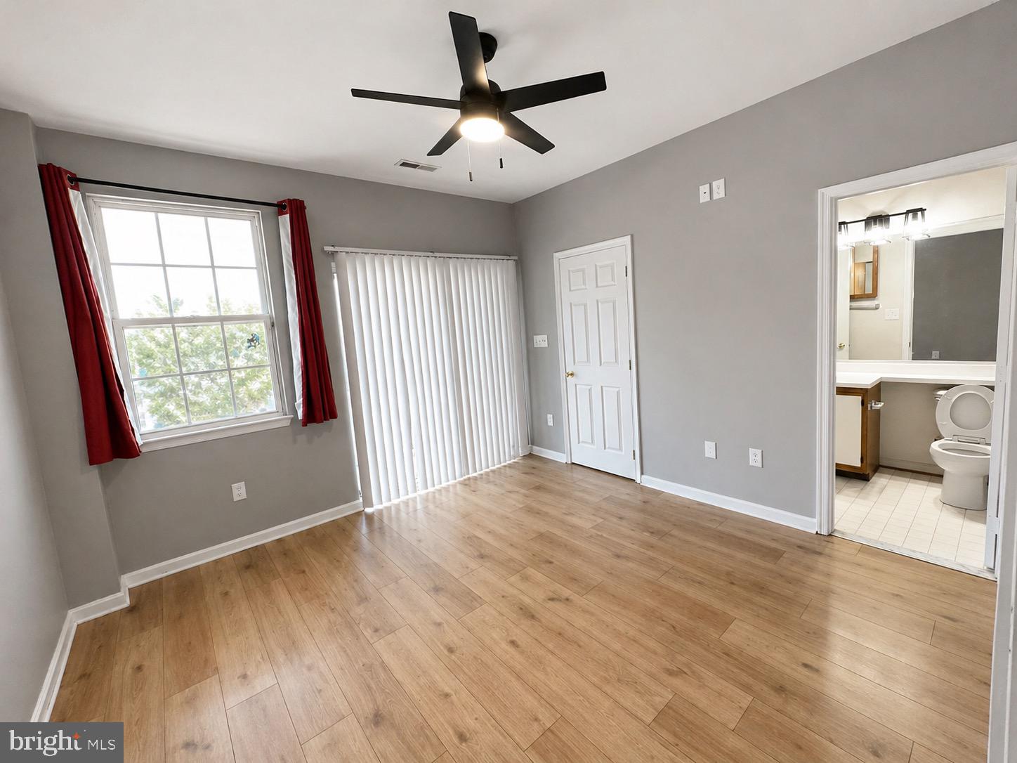 601 Forest Walk Lane, Unit 103 Odenton, MD 21113 - Photo 13 of 20 a view of a livingroom with a ceiling fan and window