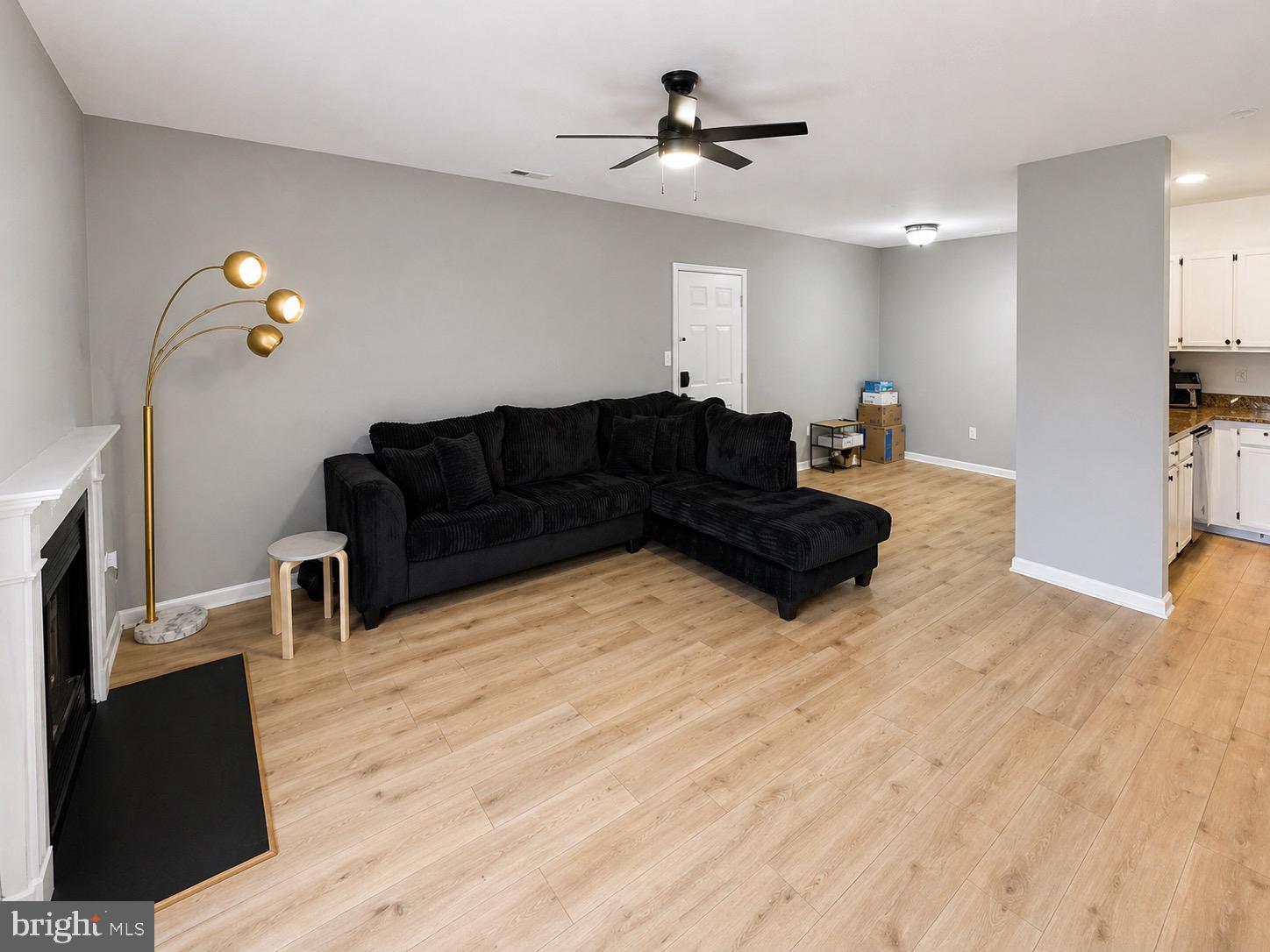 601 Forest Walk Lane, Unit 103 Odenton, MD 21113 - Photo 4 of 20 a living room with furniture and a flat screen tv