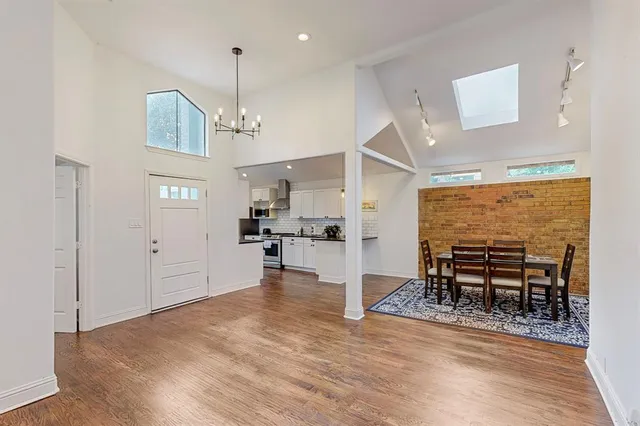 a view of a room with furniture and wooden floor