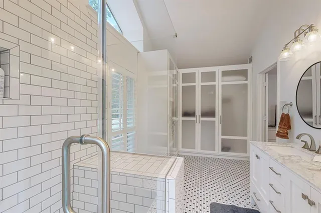 a bathroom with a bathtub and a sink