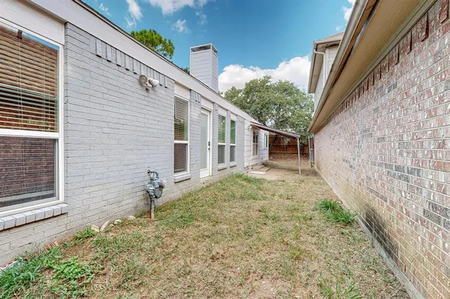a house view with a backyard space
