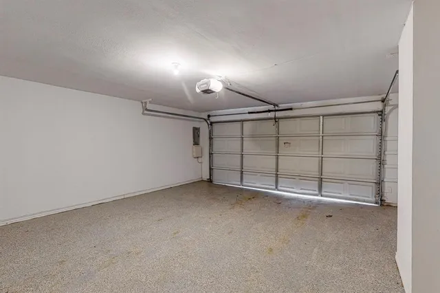 a front view of a house with a garden and yard