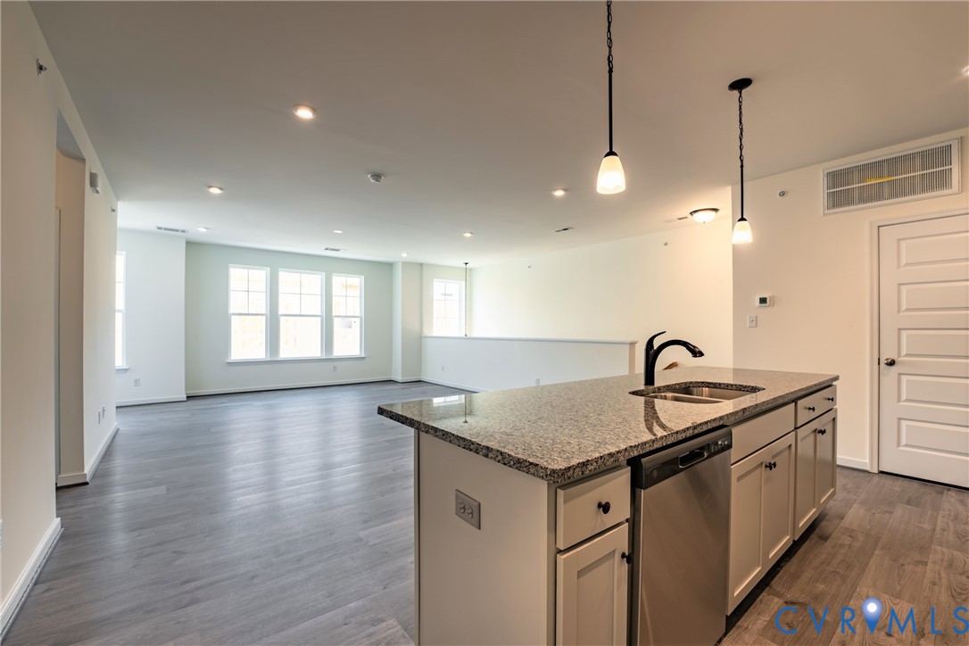 4003 Next Level Trace Midlothian, VA 23112 - Photo 5 of 38 a kitchen with stainless steel appliances granite countertop a sink a refrigerator and a stove