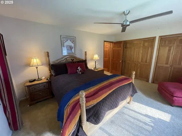 a bedroom with bed and window