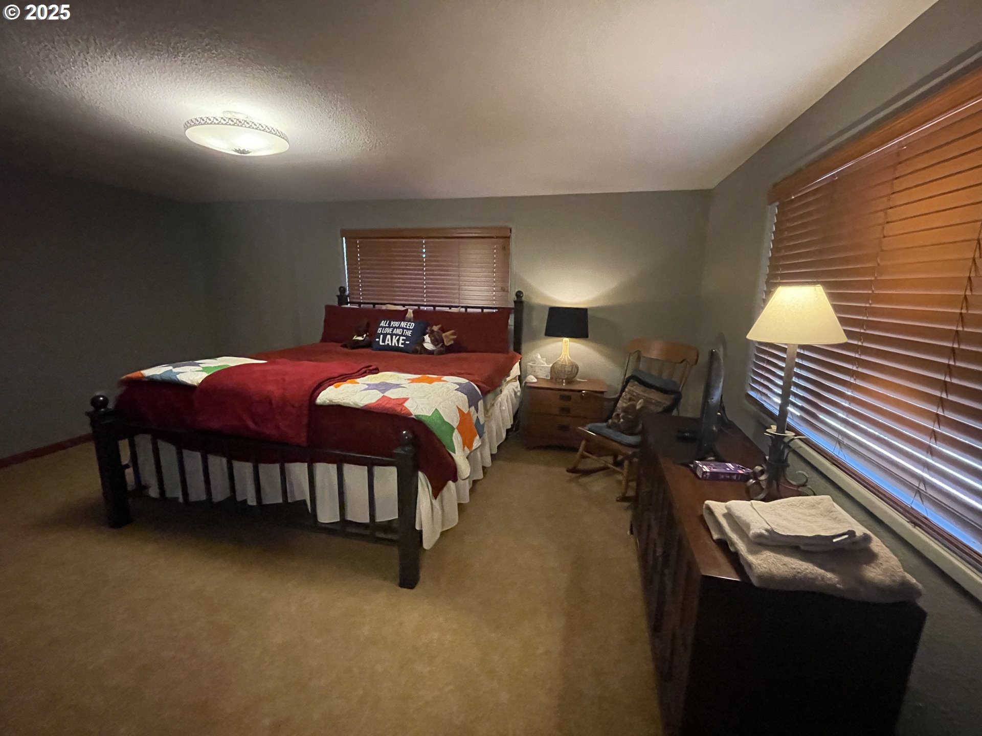 64624 West Frk Lane Joseph, OR 97846 - Photo 17 of 31 a bed room with two beds and a lamp