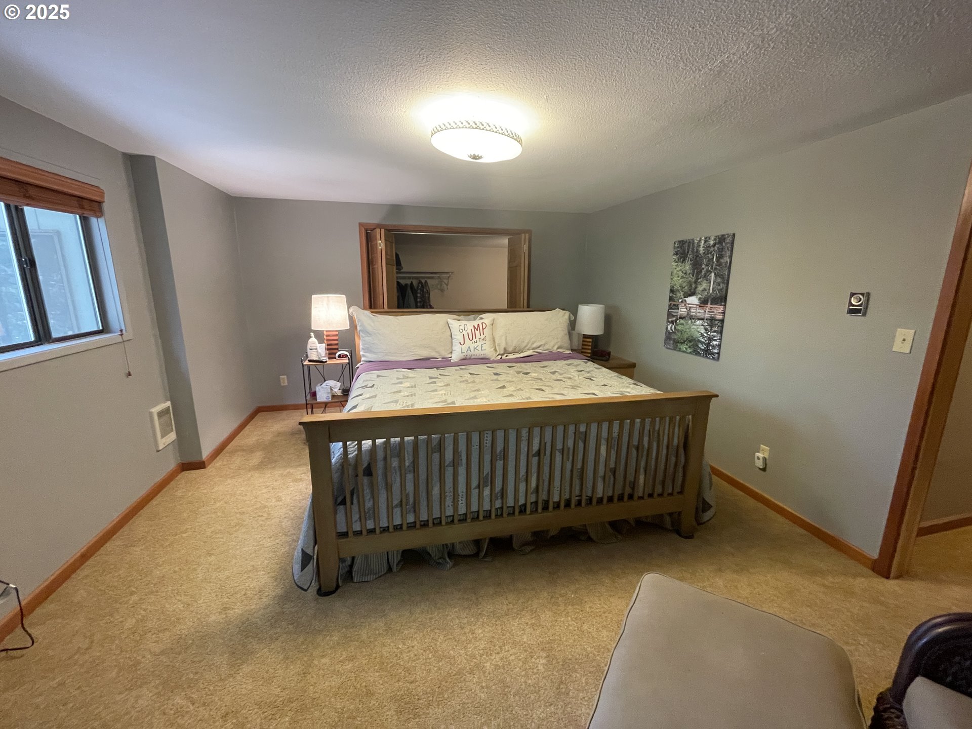 64624 West Frk Lane Joseph, OR 97846 - Photo 19 of 31 a bedroom with a bed window and a table