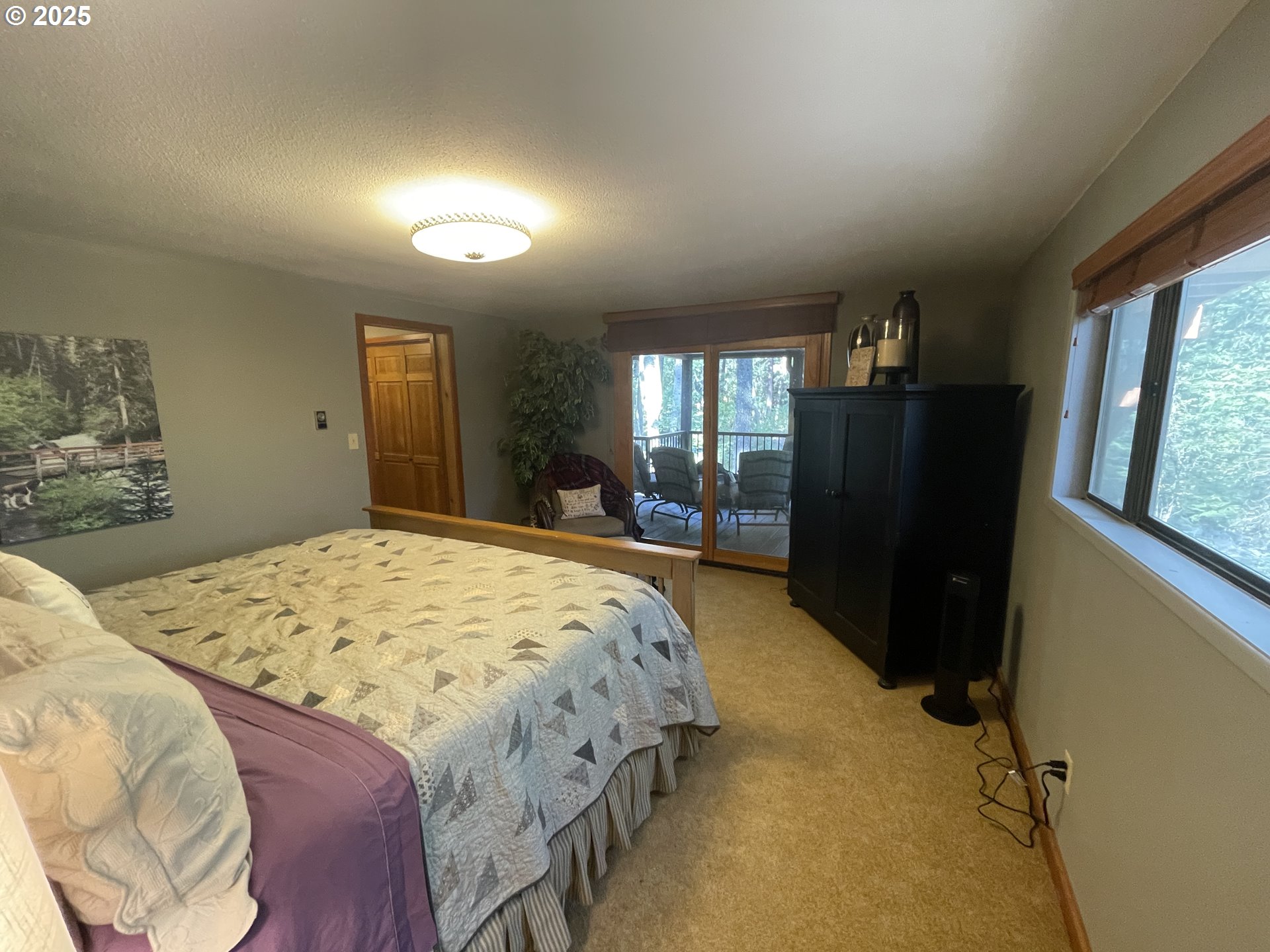 64624 West Frk Lane Joseph, OR 97846 - Photo 20 of 31 a bed sitting in a bedroom next to a window