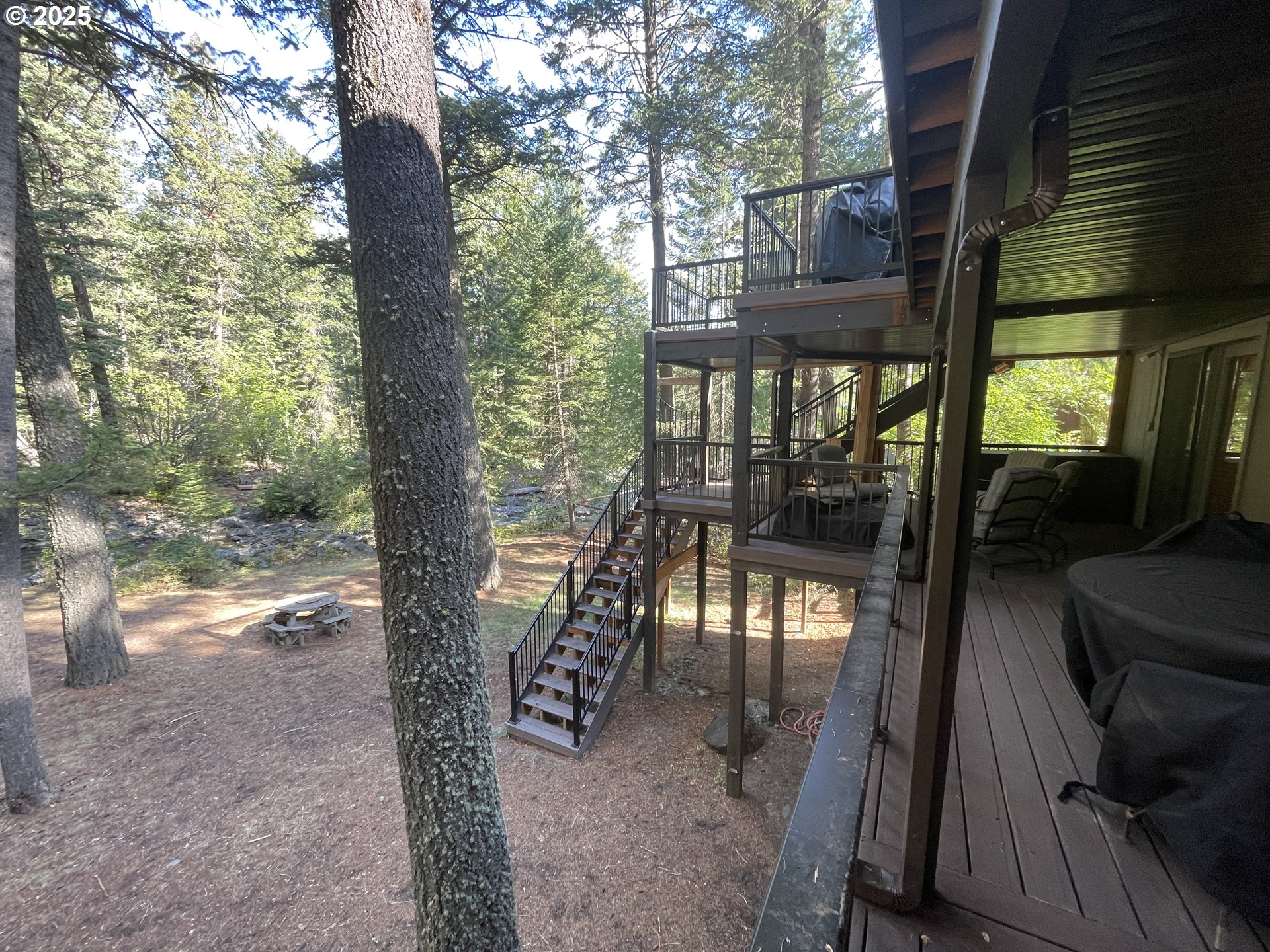 64624 West Frk Lane Joseph, OR 97846 - Photo 26 of 31 a view of a porch with chairs and backyard