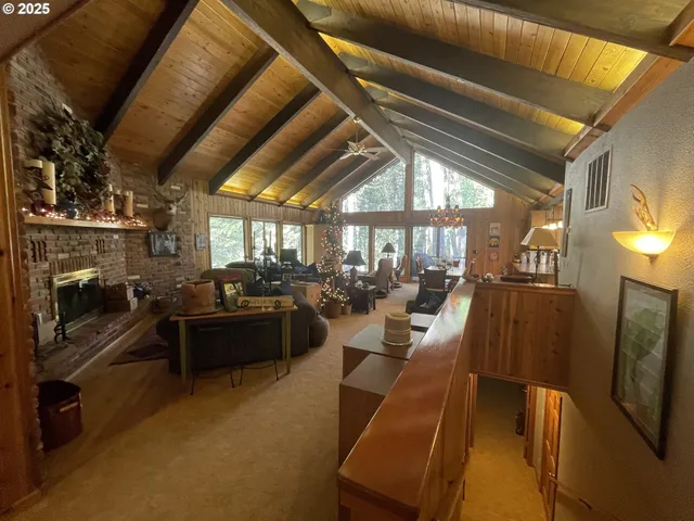 a living room with lots of furniture and a fireplace