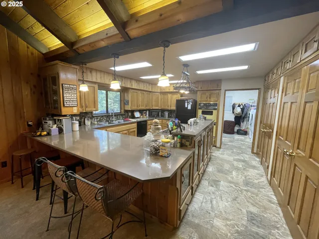 an open kitchen with a table and chairs