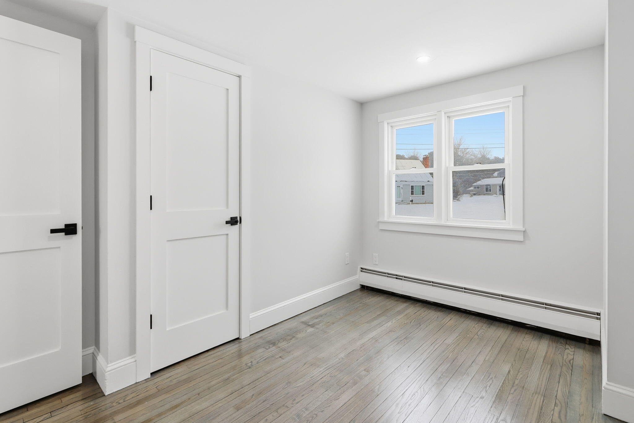 24 Hazelmoor Road South Yarmouth, MA 02664 - Photo 12 of 19 an empty room with wooden floor and windows
