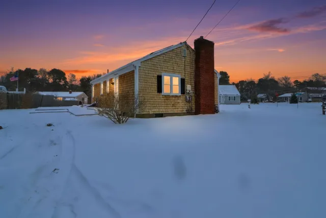 a backyard of a house with wooden fence