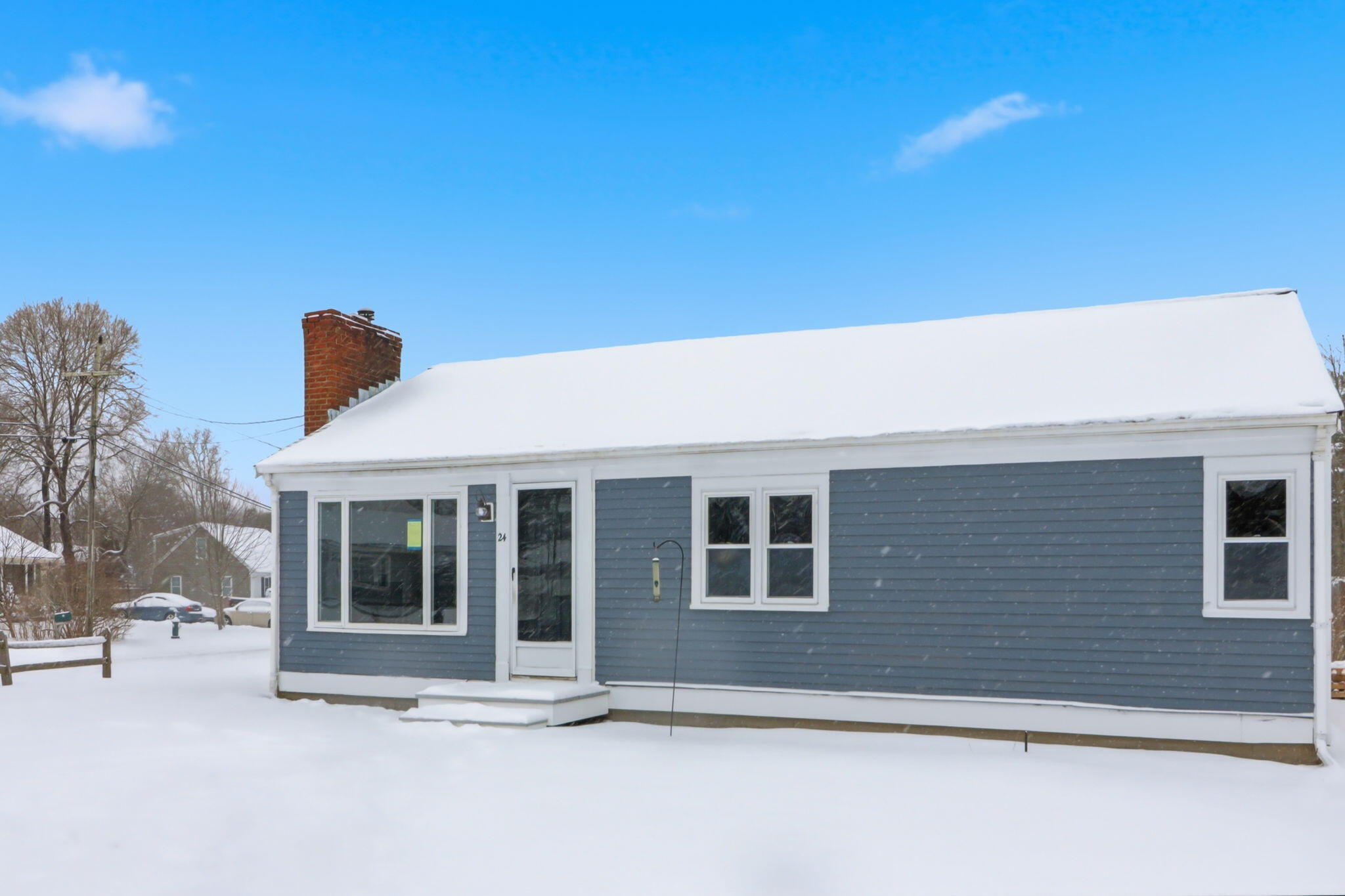 24 Hazelmoor Road South Yarmouth, MA 02664 - Photo 2 of 19 a front view of a house with a yard